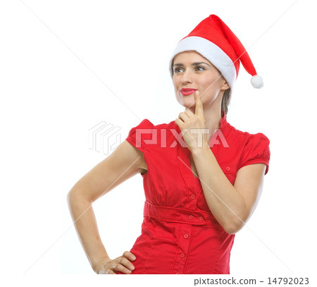 Portrait of thinking young woman in Santa hat looking on copy sp 14792023