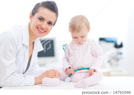 Pediatric doctor with baby on survey Pediatric doctor with baby on survey 14792090