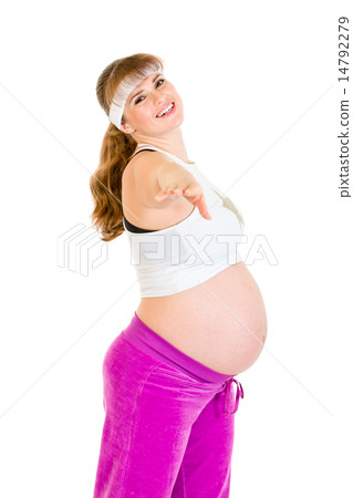Smiling beautiful pregnant female doing exercise. 14792279