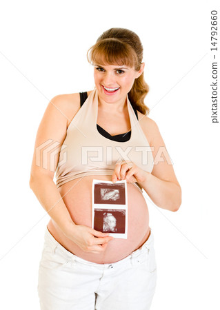 Laughing pregnant woman holding echo in hands. 14792660