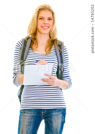 Smiling teengirl with schoolbag writing in notebook. 14793202