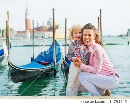 Portrait of happy mother and baby on grand canal embankment in v Portrait of happy mother and baby on grand canal embankment in v 14793345