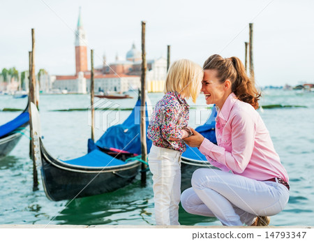 Portrait of happy mother and baby on grand canal embankment in v Portrait of happy mother and baby on grand canal embankment in v 14793347