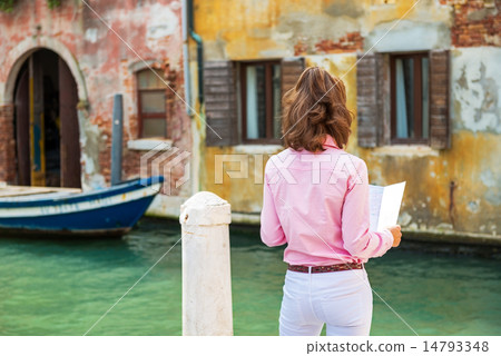 Young woman in venice, italy looking at map. rear view Young woman in venice, italy looking at map. rear view 14793348