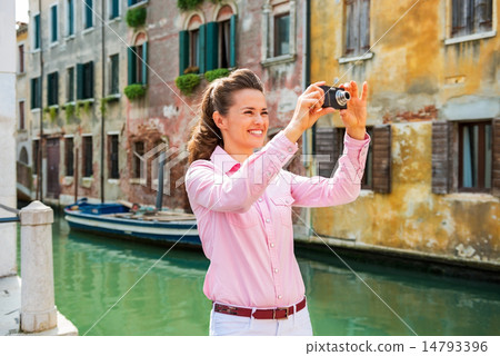 Happy young woman taking photo in venice, italy 14793396