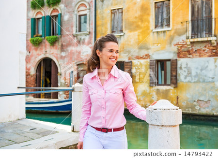 Happy young woman walking in venice, italy 14793422
