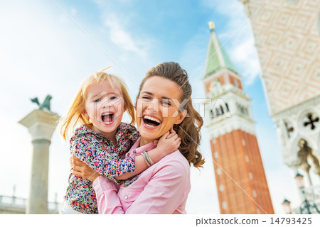 Portrait of happy mother and baby against campanile di san marco Portrait of happy mother and baby against campanile di san marco 14793425