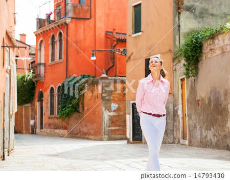 Young woman walking in venice, italy 14793430