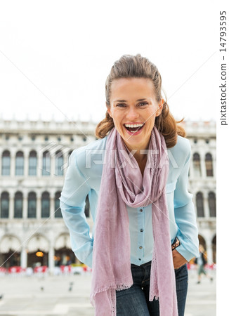 Portrait of happy young woman on piazza san marco in venice, ita 14793595
