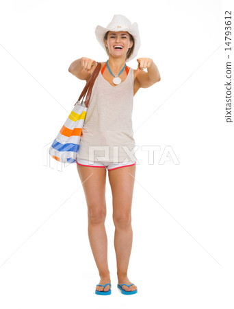 Full length portrait of happy beach young woman pointing in came 14793612