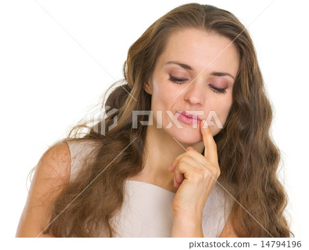 Portrait of thoughtful woman looking down Portrait of thoughtful woman looking down 14794196