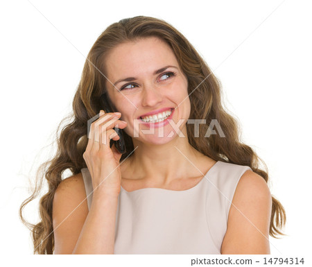 Smiling woman talking mobile phone and looking on copy space Smiling woman talking mobile phone and looking on copy space 14794314