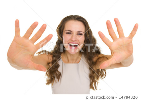 Pretty young woman pulling hands in camera Pretty young woman pulling hands in camera 14794320