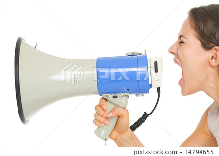 Young woman shouting through megaphone Young woman shouting through megaphone 14794655