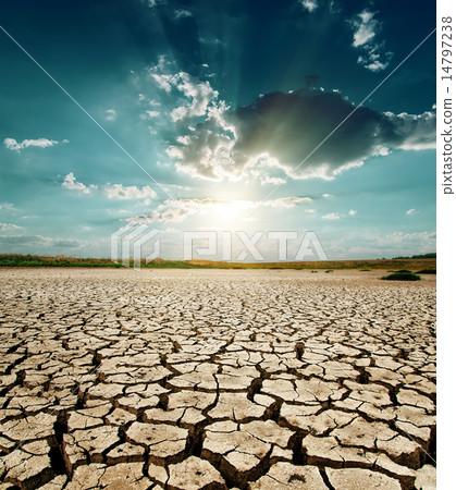 dramatic sunset over drought land 14797238