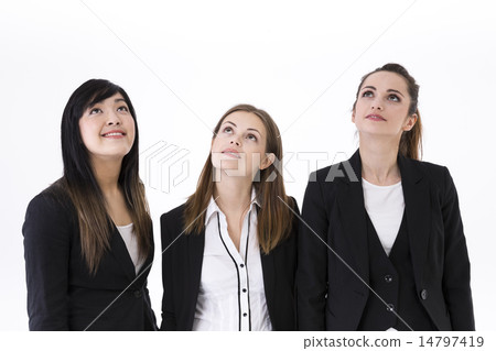 3 business women smiling and looking upwards. 3 business women smiling and looking upwards. 14797419