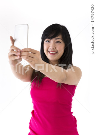Asian Woman taking 'selfie' portrait photograph. Asian Woman taking 'selfie' portrait photograph. 14797420