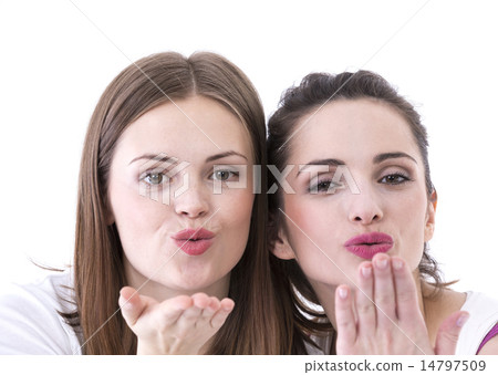 Two beautiful women blowing a kiss at you. 14797509