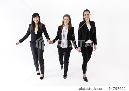 Team of three business women holding hands. 14797621