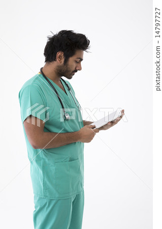 Male Indian doctor wearing a Green Scrubs. Male Indian doctor wearing a Green Scrubs. 14797727