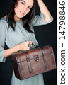 Woman with suitcase 14798846
