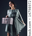 Woman with case 14798972