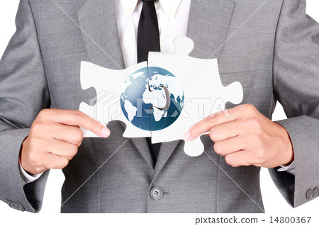 Businessman holding mismatch jigsaw 14800367