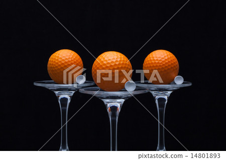 Three glasses of champagne and golf balls Three glasses of champagne and golf balls 14801893