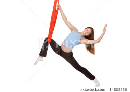 Young woman doing anti-gravity aerial yoga Young woman doing anti-gravity aerial yoga 14802386