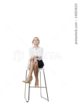 Smiling businesswoman sitting  14803620