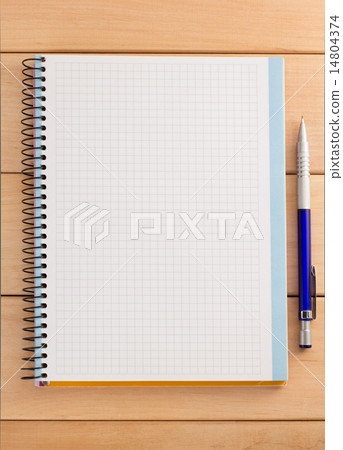 checked notebook on wood checked notebook on wood 14804374