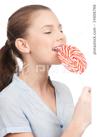 Pretty young woman with lollipop. Isolated Pretty young woman with lollipop. Isolated 14806766