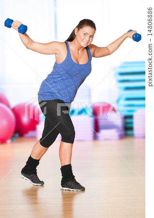 Woman doing fitness exercise at sport gym Woman doing fitness exercise at sport gym 14806886