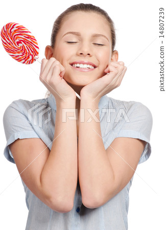 Pretty young woman with lollipop. Isolated 14807239