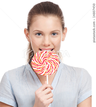 Pretty young woman with lollipop. Isolated 14807450