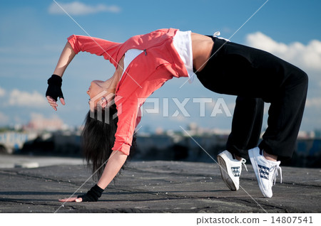 woman dancing hip hop over blue sky woman dancing hip hop over blue sky 14807541