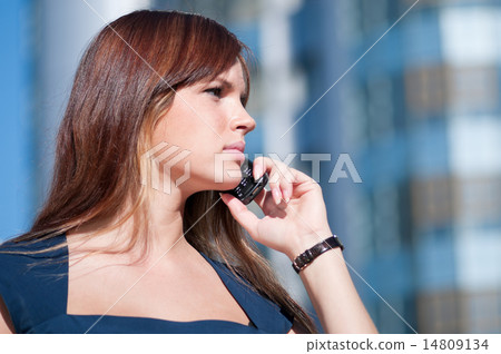 Businesswoman make call by mobile phone. 14809134