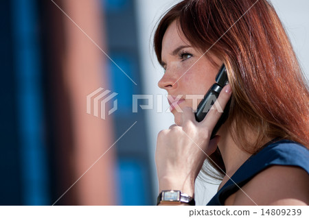 Businesswoman make call by mobile phone. 14809239