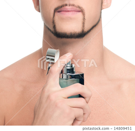 Young handsome man applying perfume 14809451