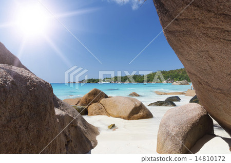 White coral beach sand and azure indian ocean. 14810172