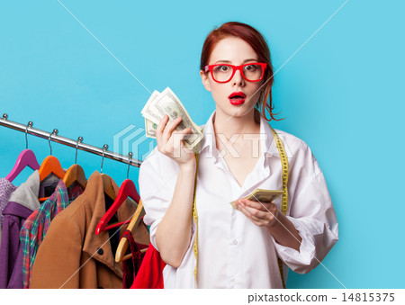Young redhead designer with dollars Young redhead designer with dollars 14815375