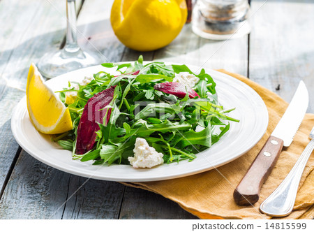 Fresh green salad with beets, goat cheese, olive 14815599