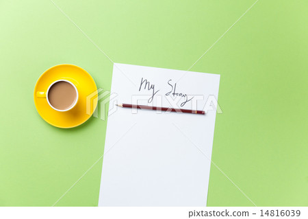 yellow cup of coffee with paper and pencil 14816039