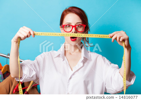 Surprised young redhead designer with metric Surprised young redhead designer with metric 14816077
