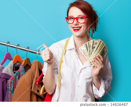 Young redhead designer with dollars Young redhead designer with dollars 14816487