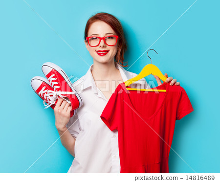 Young redhead designer with dress and gumshoes 14816489