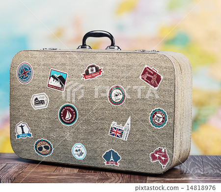 old suitcase with stikkers on the floor 14818976