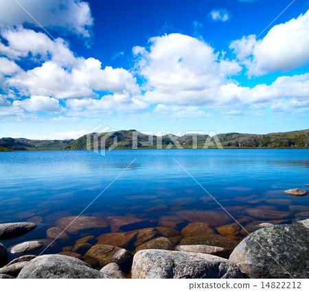 Blue lake idill under cloudy sky Blue lake idill under cloudy sky 14822212