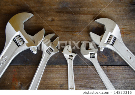 Spanner or adjustable wrench on wooden back ground Spanner or adjustable wrench on wooden back ground 14823316