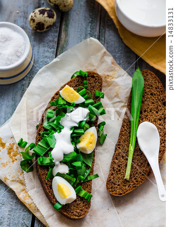 bread with wild garlic, sour cream and quail eggs bread with wild garlic, sour cream and quail eggs 14833131